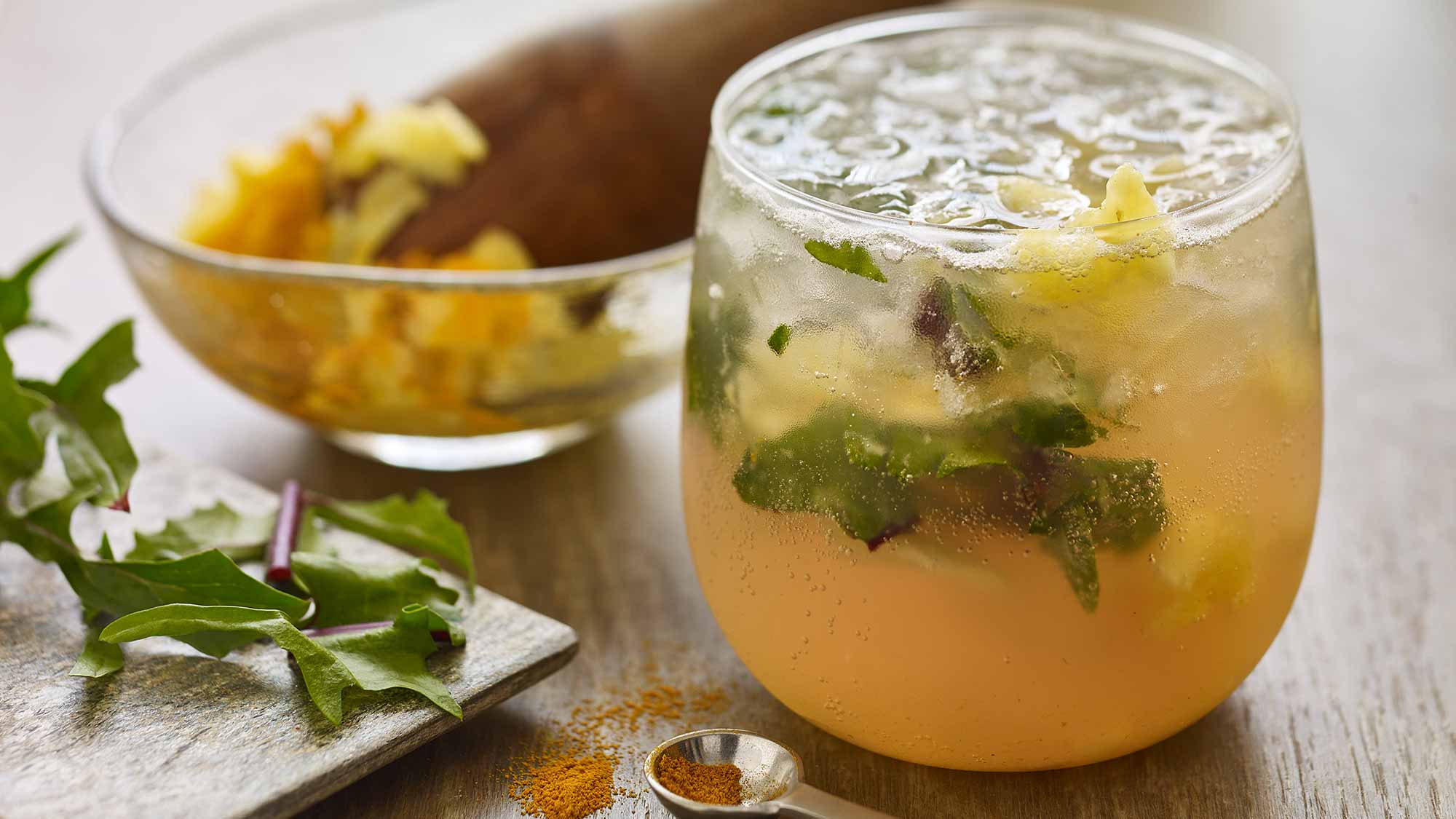 pineapple_turmeric_mocktail_with_muddled_dandelion_greens
